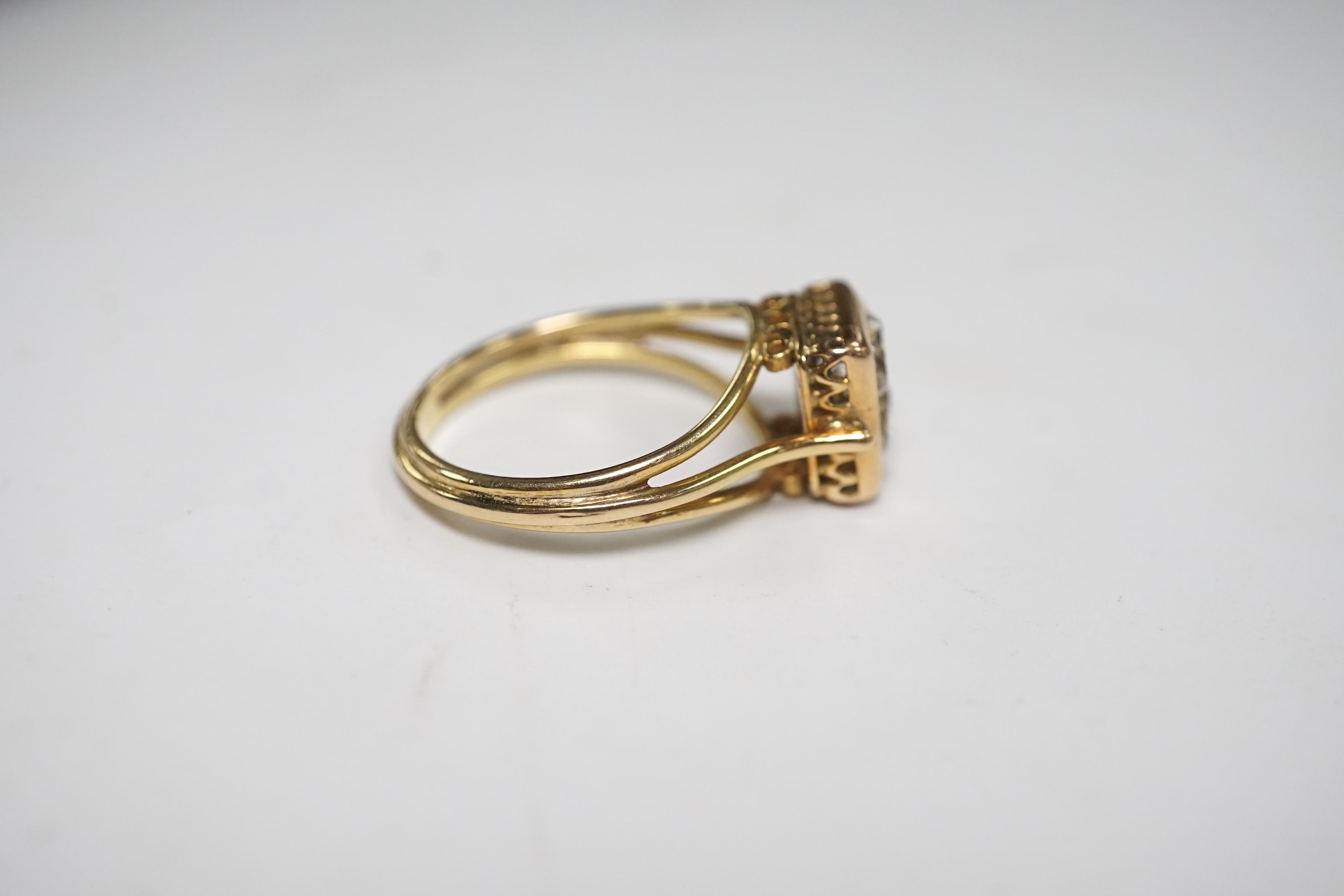 A yellow metal and four stone old mine cut diamond set square cluster ring, size O, gross weight 4.5 grams. Condition - fair to good
